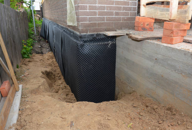 Happy homeowners after waterproofing job in Maysville